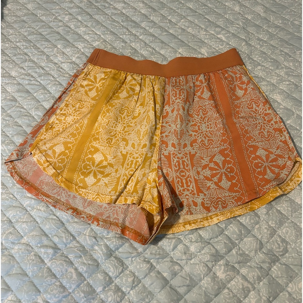 Free People Movement Multi-color shirts Size Small but fit very loose.